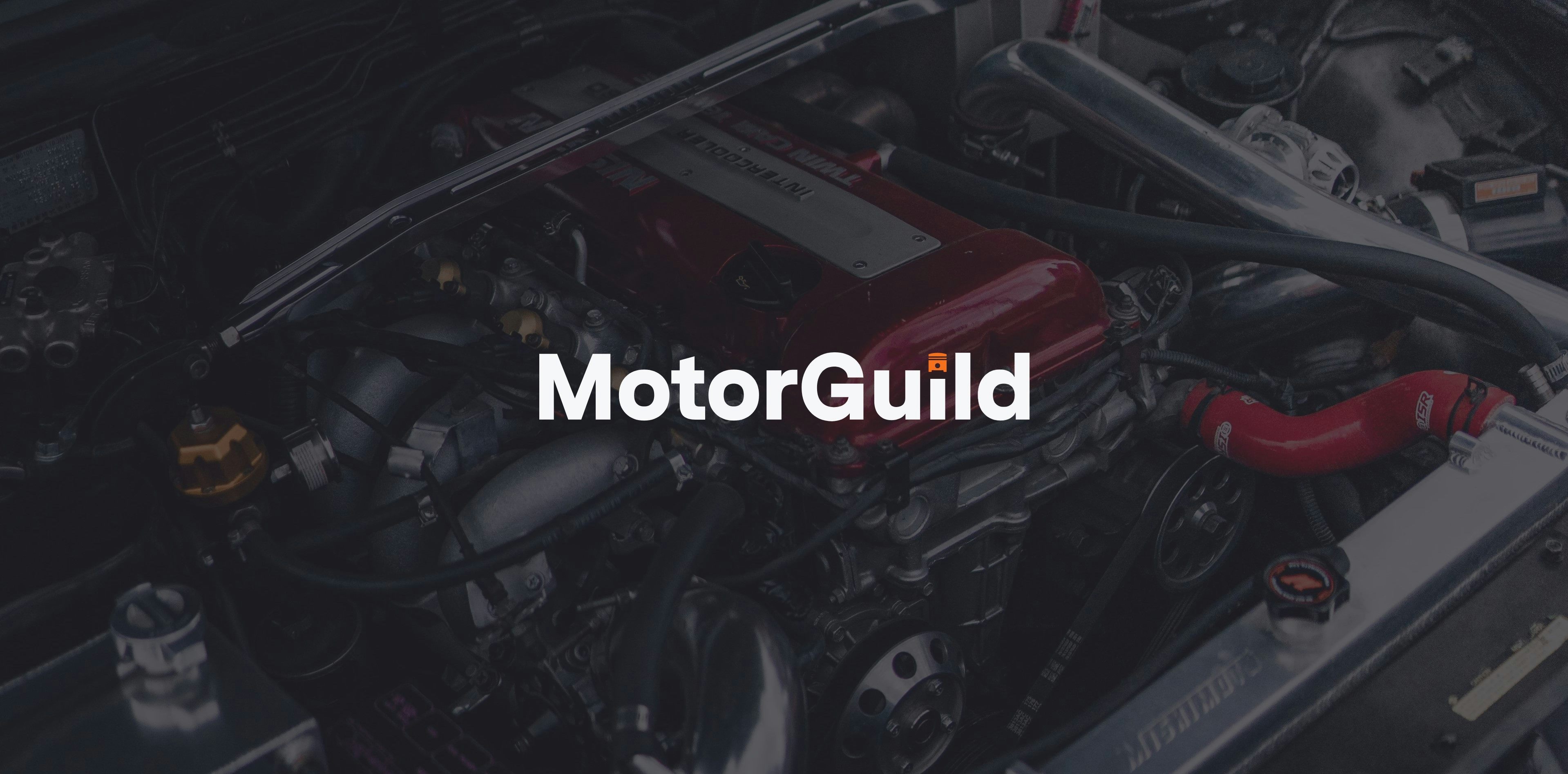 A photo of a modified engine bay overlayed with the MotorGuild logo.